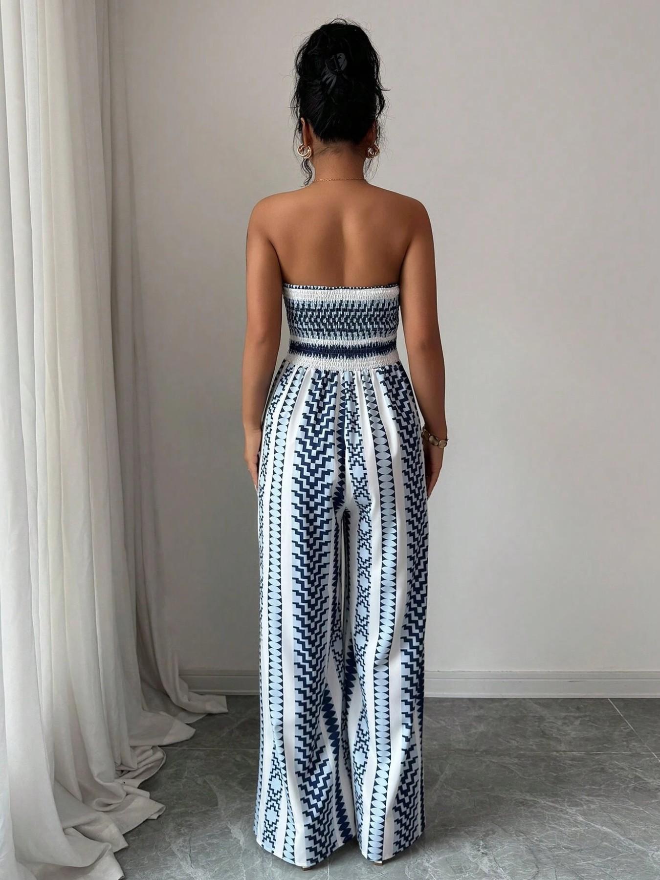 👗 50% OFF NOW! 💥 Geometric Jumpsuit with Halter Neckline & Side Slit – Unique print & elastic back – Versatile, perfect for summer parties or resort wear ✨